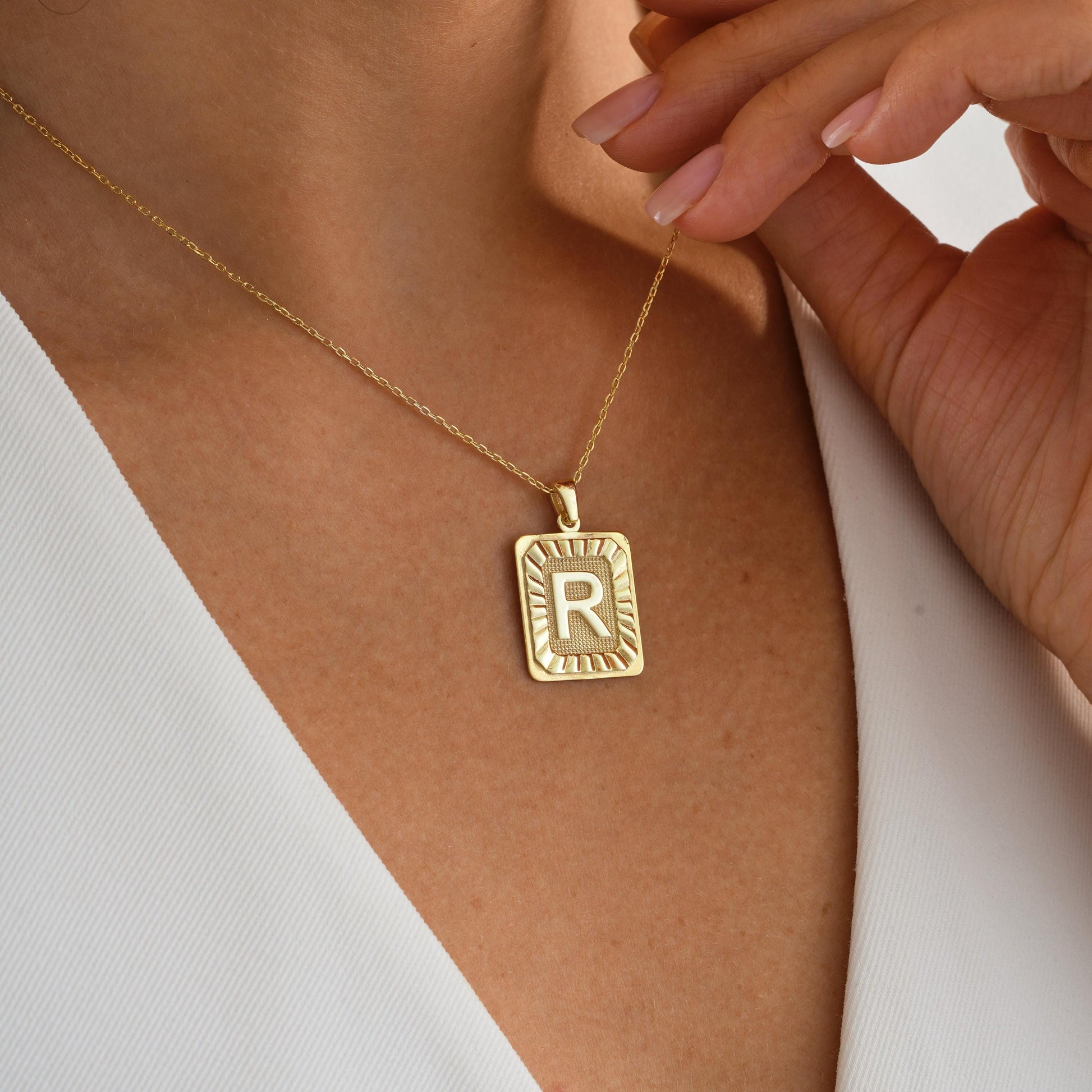 ✨ Initial Plate Pendant – Bold Identity, Timeless Design ✨  

This rectangle initial pendant features a bold raised letter framed by sunray detailing, giving it a striking and vintage-inspired look. Made from 925K Sterling Silver / 14K Solid Gold, it’s the perfect gift for someone special—or yourself.
• Pendant: Rectangular plate with raised letter and sunburst pattern  


🎯 Perfect For:  
Monogram lovers – Statement jewelry fans – Birthday gift – Personalized everyday wear – Gift for her
