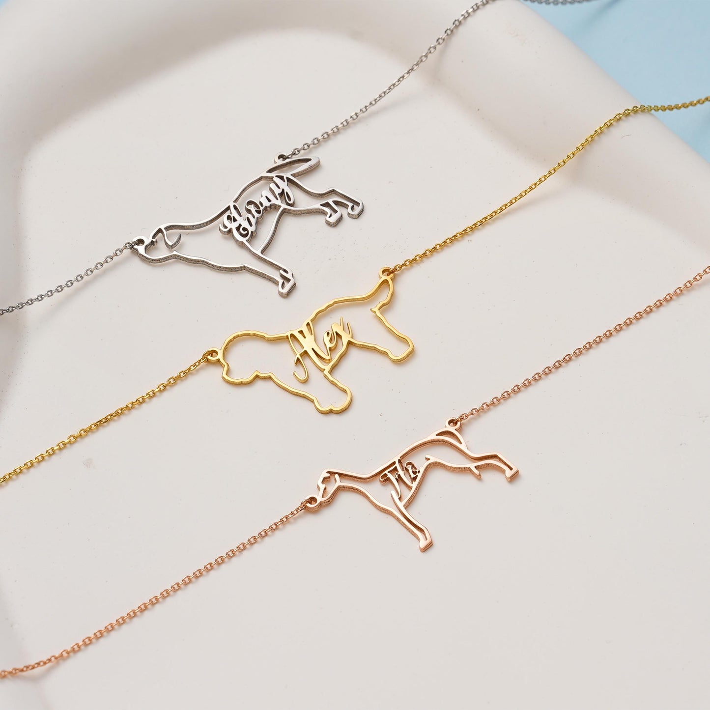 Custom Dog Name Necklace – Personalized Pet Outline Pendant ✨  

A unique necklace featuring your dog’s silhouette with your chosen name elegantly integrated into the design. Perfect for pet lovers and a meaningful keepsake to celebrate your furry friend.

💛 Product Details  
• Material: 925K Sterling Silver / 14K Solid Gold  
• Closure: Spring Ring  
• Pendant Size: Approx. 30–40mm (varies by breed)  
• Sold as: Pendant with chain included  
• Hypoallergenic & safe for sensitive skin
