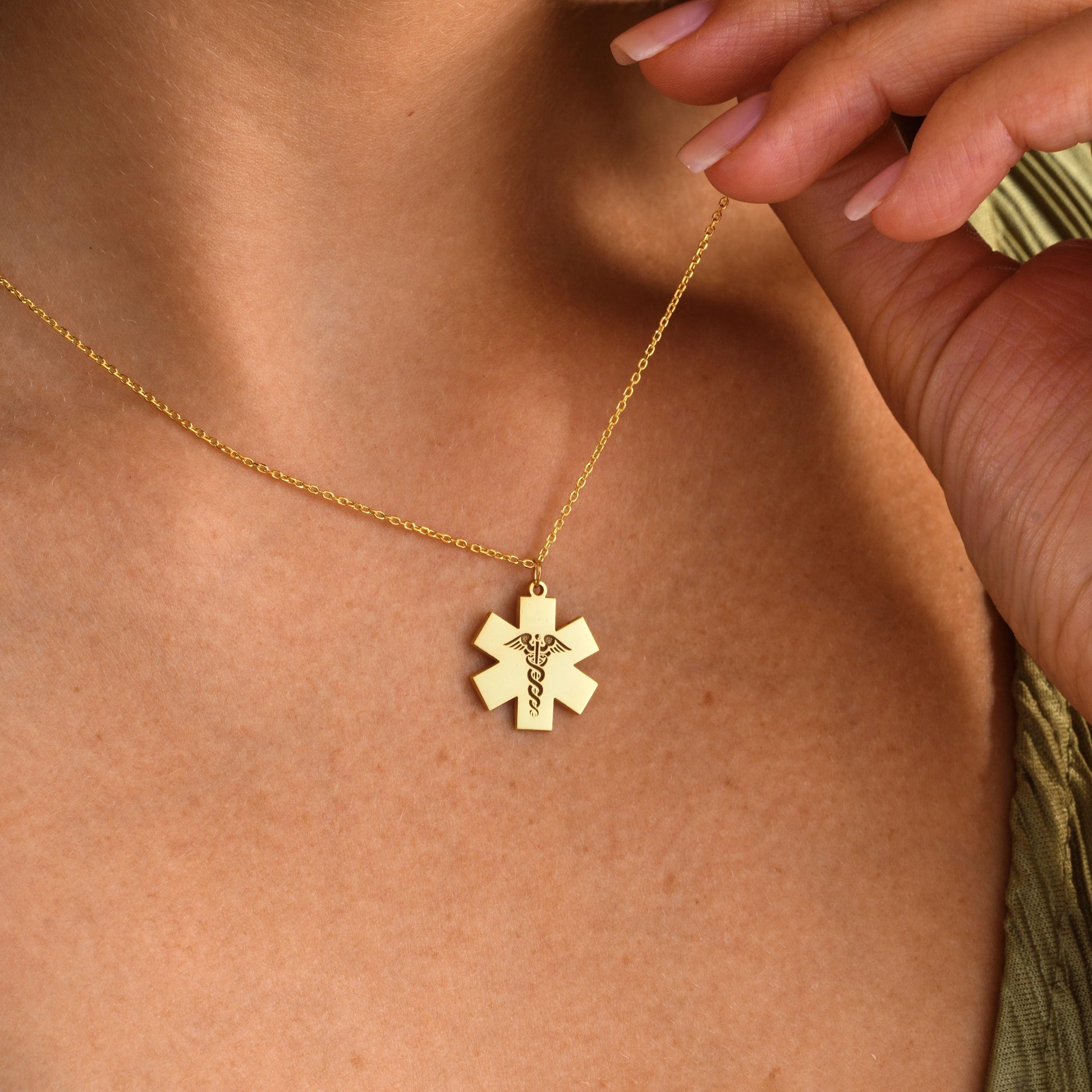 ✨ Star of Life Necklace – Engraved Caduceus Pendant ✨  

A meaningful and elegant necklace featuring the Star of Life medical symbol with an engraved caduceus sign. Perfect for paramedics, doctors, nurses, or as a gift for someone in the medical field.

💛 Product Details  
• Material: 925K Sterling Silver / 14K Solid Gold  
• Closure: Spring Ring  
• Pendant Size: Approx. 20mm  
• Sold as: Pendant with chain included  
• Hypoallergenic & safe for sensitive skin