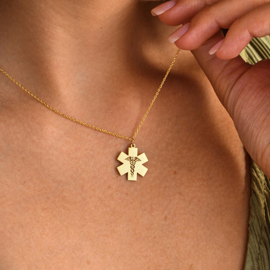 ✨ Star of Life Necklace – Engraved Caduceus Pendant ✨  

A meaningful and elegant necklace featuring the Star of Life medical symbol with an engraved caduceus sign. Perfect for paramedics, doctors, nurses, or as a gift for someone in the medical field.

💛 Product Details  
• Material: 925K Sterling Silver / 14K Solid Gold  
• Closure: Spring Ring  
• Pendant Size: Approx. 20mm  
• Sold as: Pendant with chain included  
• Hypoallergenic & safe for sensitive skin
