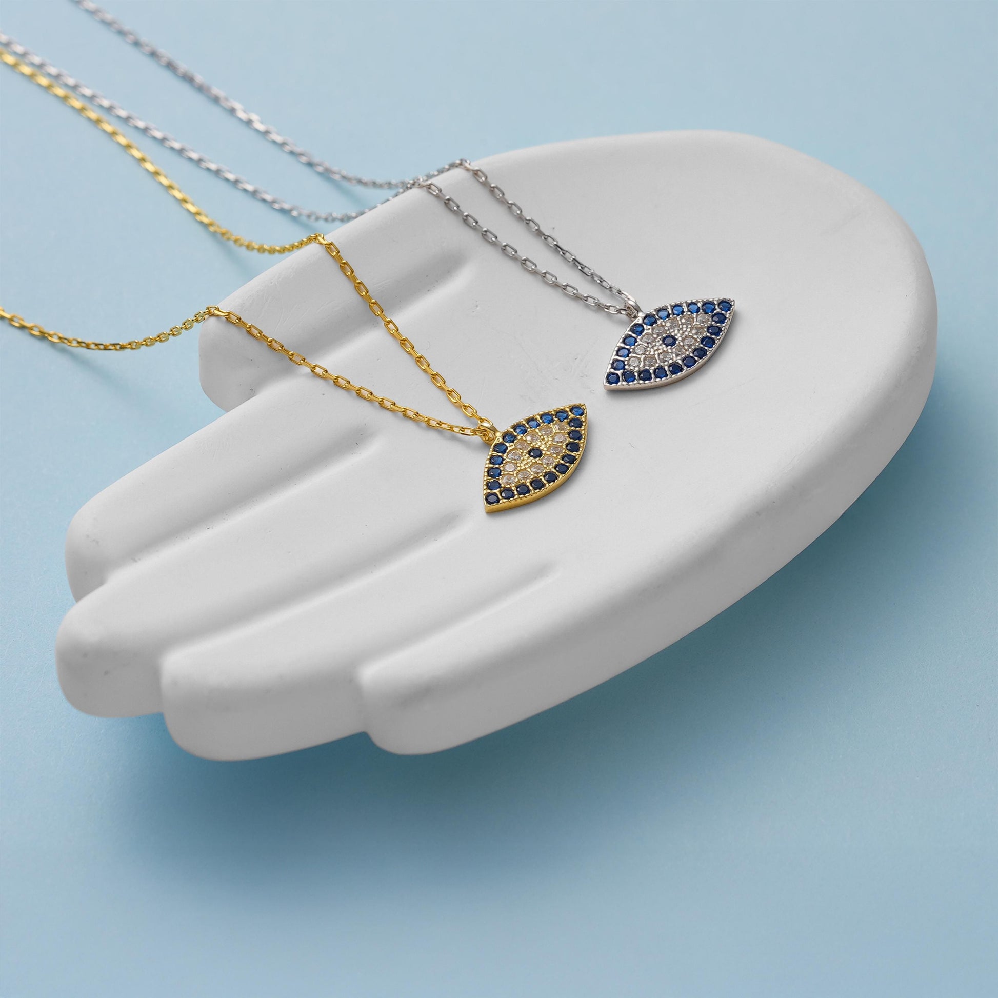 ✨ CZ Evil Eye Charm Necklace – Protective Amulet Jewelry ✨

A stunning and symbolic necklace featuring a CZ-studded evil eye charm, known for protection and good fortune. Perfect for daily wear or as a meaningful gift.
🎯 Perfect For:
Daily wear, protective talisman, birthday gift, anniversary, or special occasions.

💛 Product Details
• Material: 925K Sterling Silver / 14K Solid Gold
• Closure: Spring Ring
• Pendant Size: Approx. 15mm
• Hypoallergenic & safe for sensitive skin